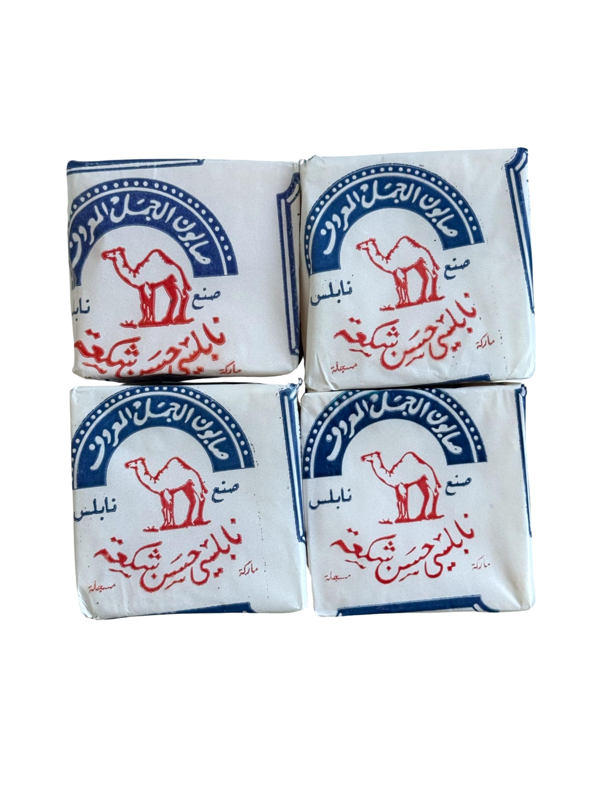 Four square packets of Syrian Nablus soap with camel illustrations and Arabic text on the packaging.